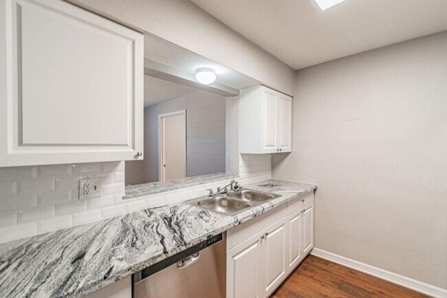 Building Photo - PRICE JUST REDUCED 3/2/1 1389 Sq. Ft. on a huge corner lot with granite & custom tile work!!