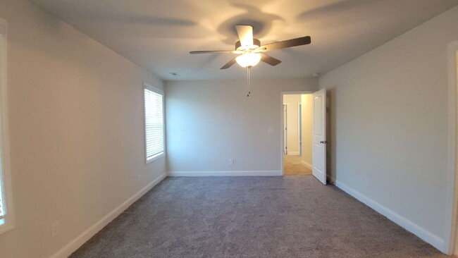 Building Photo - "Spacious 4-Bedroom Retreat with Modern Gr...