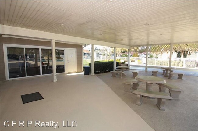 Lanai with picnic tables at pool - 144 Reserve Cir