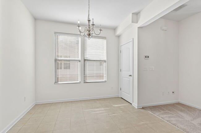 Building Photo - Spacious 4-Bedroom End-Unit Townhome in a ...