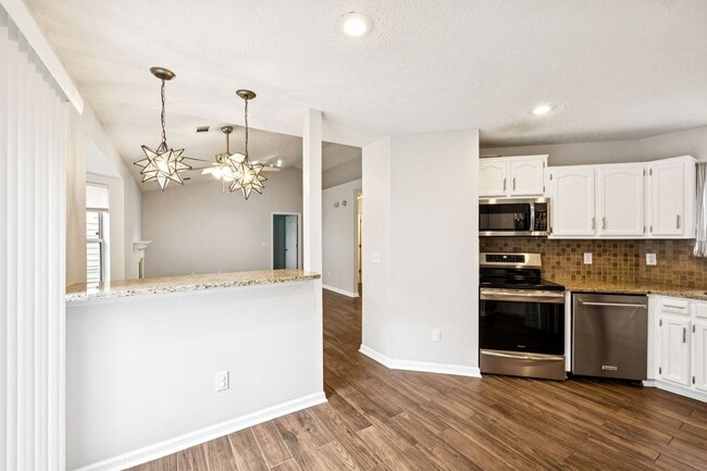 Building Photo - Welcome to this beautifully remodeled sing...