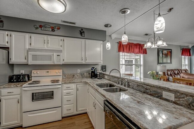 Building Photo - Lovely, Furnished Two- Bedroom, Two-Bath Condo in River Oaks Available Soon!