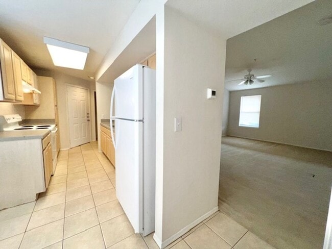 Building Photo - Move in NOW- Spacious 2 bedroom 1 bath condo on 3rd floor in gated community! Water included with...