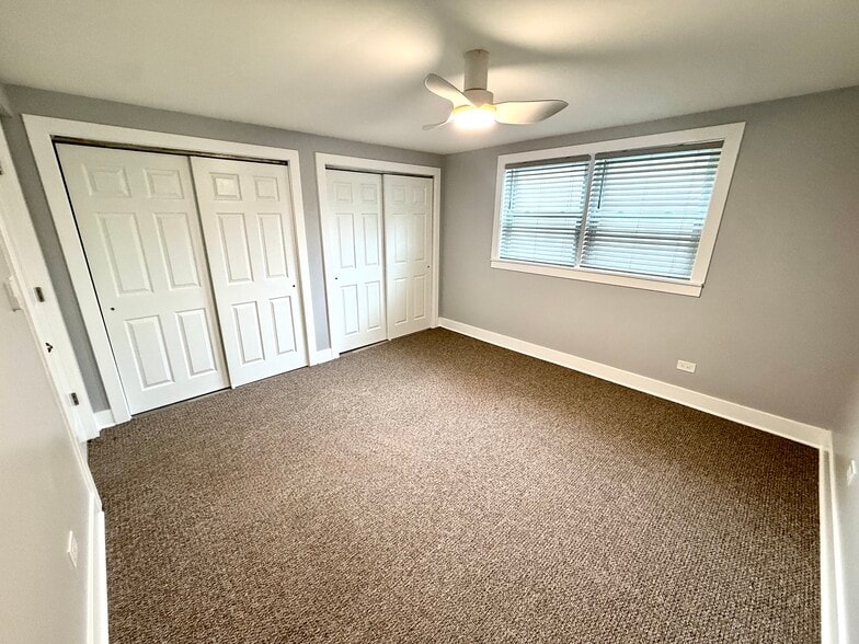 Large main bedroom, two large closets, new fan, & 1.5” slat blinds. - 16W671 56th St