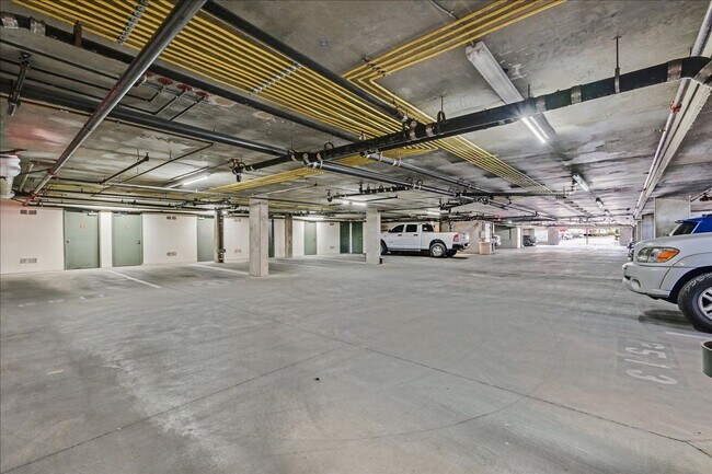 Building Photo - Top level 2 bedroom condo located in guard...
