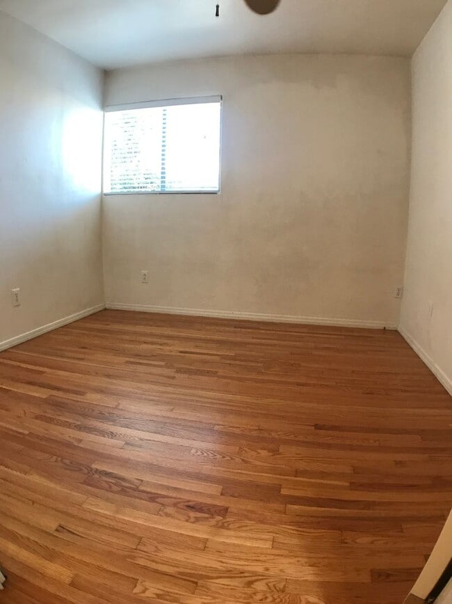 Building Photo - BEAUTIFUL WOOD FLOORS IN THIS 5 BED 2 BATHROOM HOUSE- LARGE DOGS OK