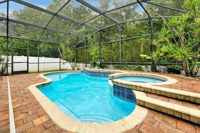 Building Photo - "Stunning 3BR Orlando Home with Private Screened Pool, Spa & Spacious Living Areas"