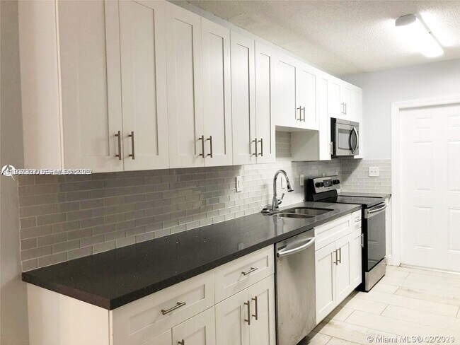 Building Photo - 1235 NE 3rd Ave