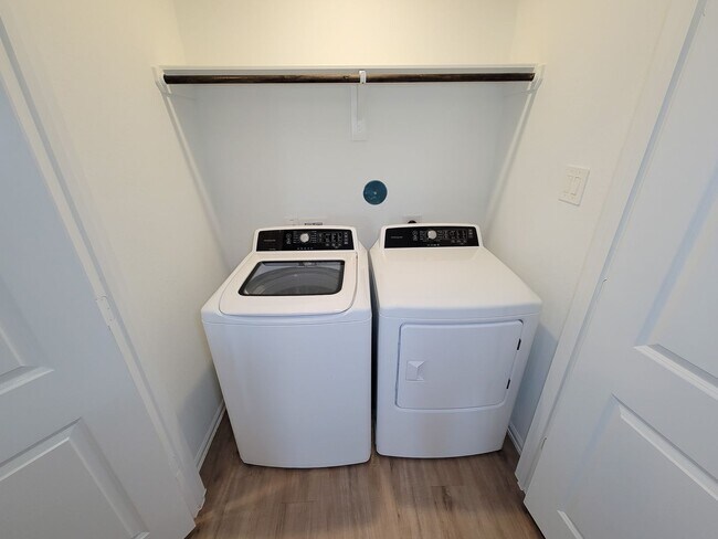 Building Photo - This single-story home has a comfortable layout with three bedrooms and a living area all on one ...