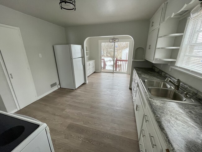 View from garage entrance through kitchen and dining area to large back yard - 1831 Smith St