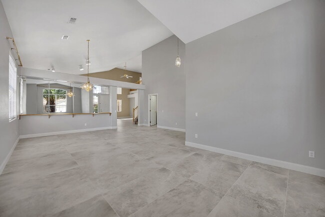 Building Photo - Spacious 4-bedroom, 3-car garage home feat...