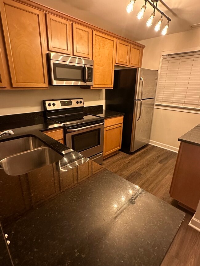 Kitchen with SS appliances - 1215 Green Oaks Ln