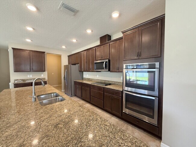 Building Photo - Spacious 4-Bedroom Retreat with additional office/den in the Heart of Trinity!