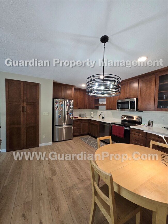 Building Photo - Chanhassen updated Townhome, Park view, 2 Car Garage, Large deck + Walkout Patio, available Aug