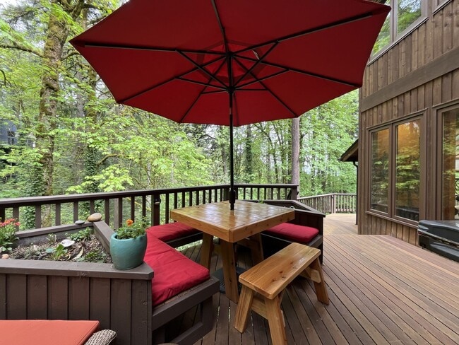 Building Photo - One-of-a-Kind Custom Home with Wall of Windows, Stone Fireplaces, Expansive Entertainment Space &...