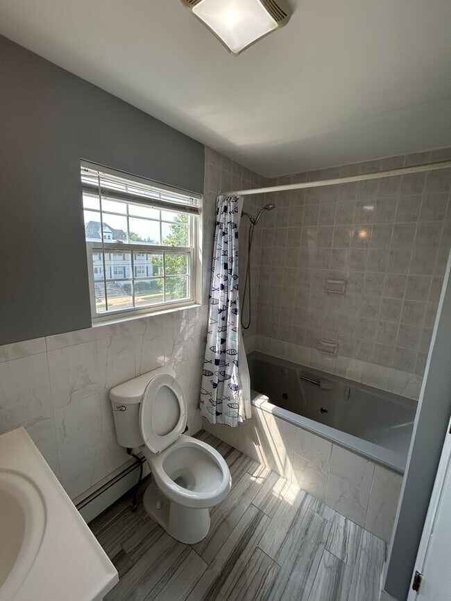 Building Photo - Discover Your Dream Home in Neptune: Spacious 4-Bedroom, 2.5-Bath with Private Backyard and Drive...