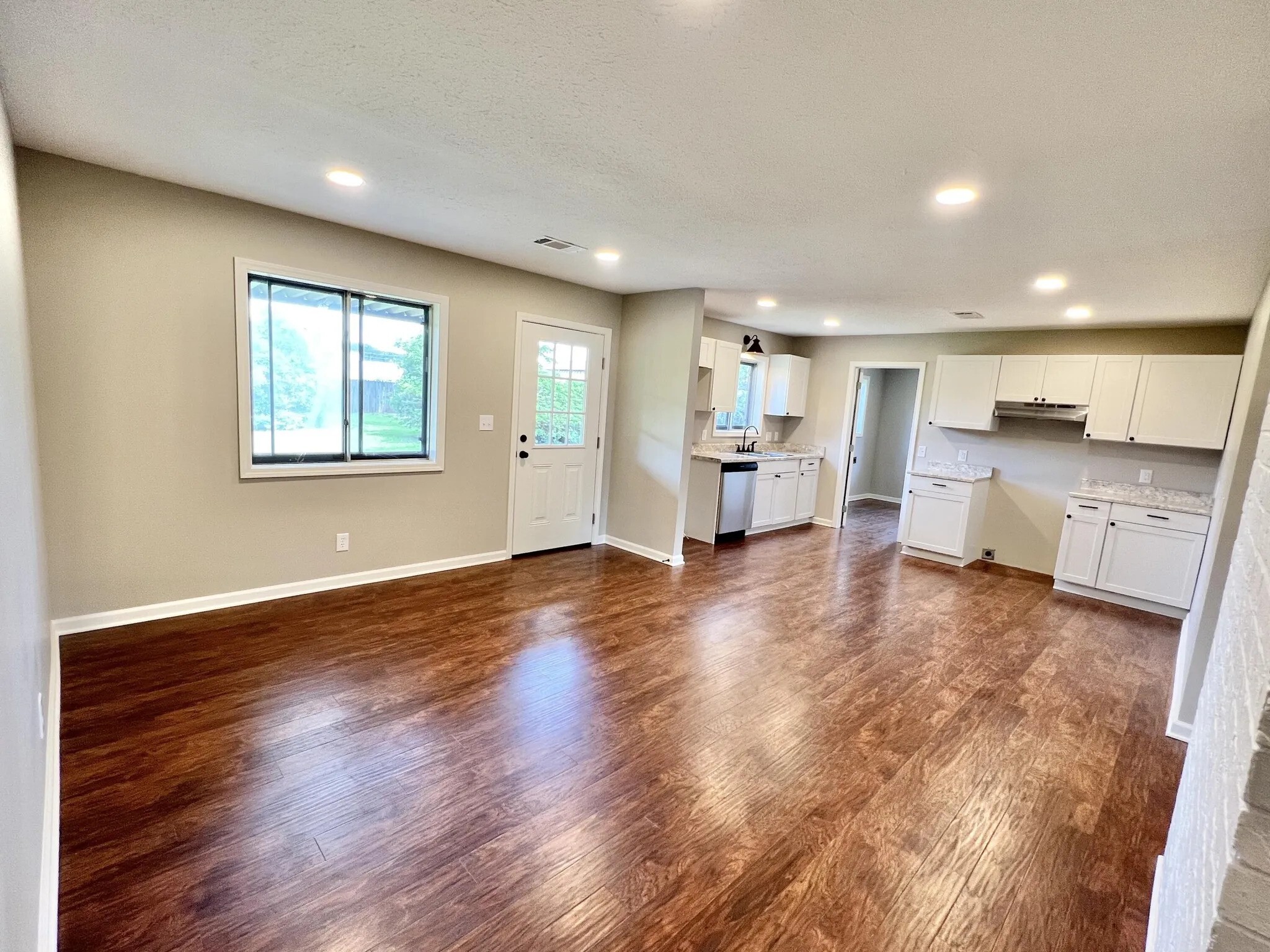 kitchen and dining room (now has appliances and kitchen island and dining table etc) - 3412 Camellia Cir