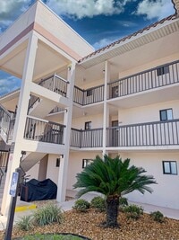 Building Photo - Beautifully Renovated, Fully Furnished Beach Condo just a short walk from the ocean.