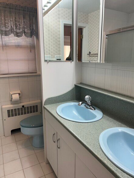 Bathroom with two vanities and corian countertop - 197 Carter Ln