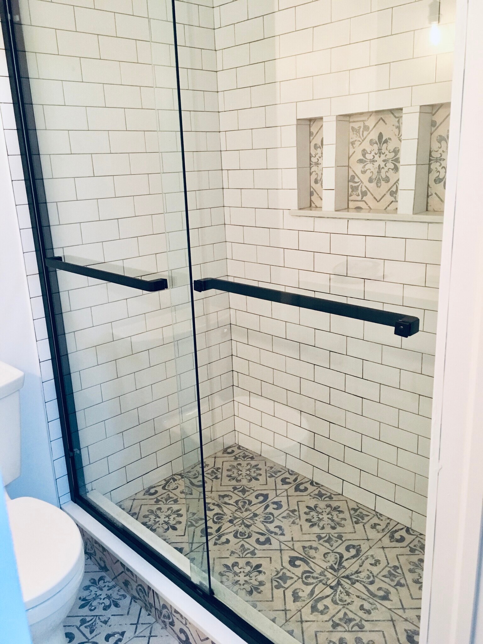 Bathroom with bold pattern flooring and shower nook - 188 Flax Hill Rd