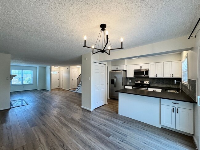 Building Photo - Completely Renovated & Ready 02-25-26! 2 Primary Suites, All Appliances Convey and Dog-Friendly!