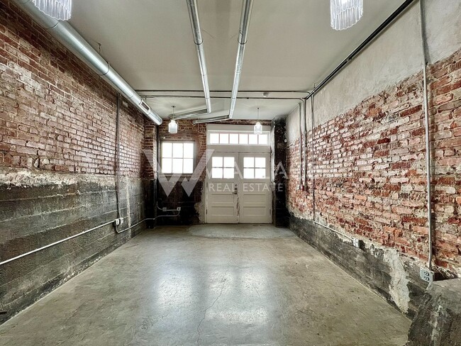 Building Photo - DOWNTOWN LIVING WITH PRIVATE GATED ENTRANC...