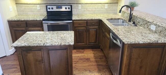 Kitchen w/ stainless steel appliances - 1974 N Dixie Ave