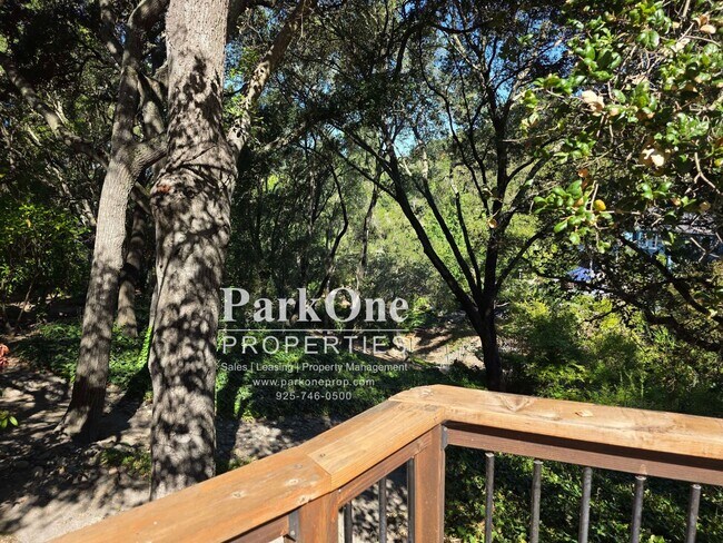 Building Photo - Spacious Home on a Private Wooded Lot Now Available!