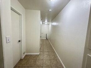 Building Photo - Fresh interior paint, new lighting fixtures, large living room, hall with laundry hook ups.