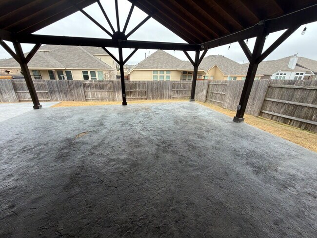 Building Photo - Four bed two bath on a corner lot with a pool in Sunfield. Gas cook top, double ovens. Open kitch...