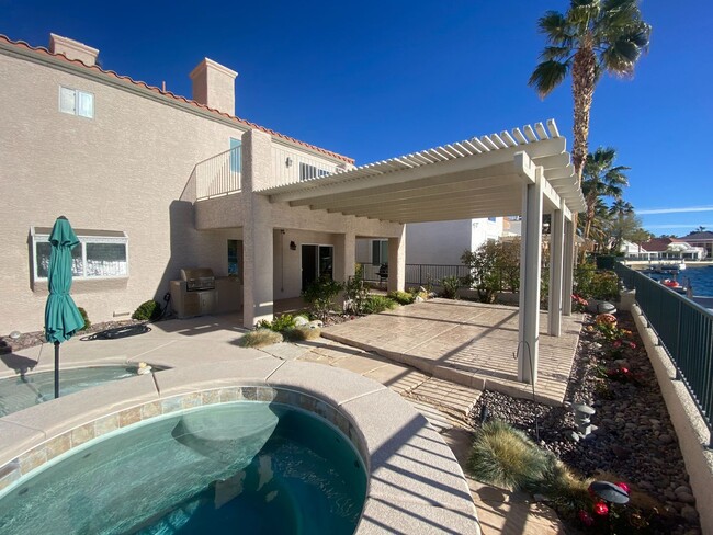 Building Photo - Vegas's Only Available Waterfront Rental ~ 4 Bedroom Desert Shores Lake Front Home