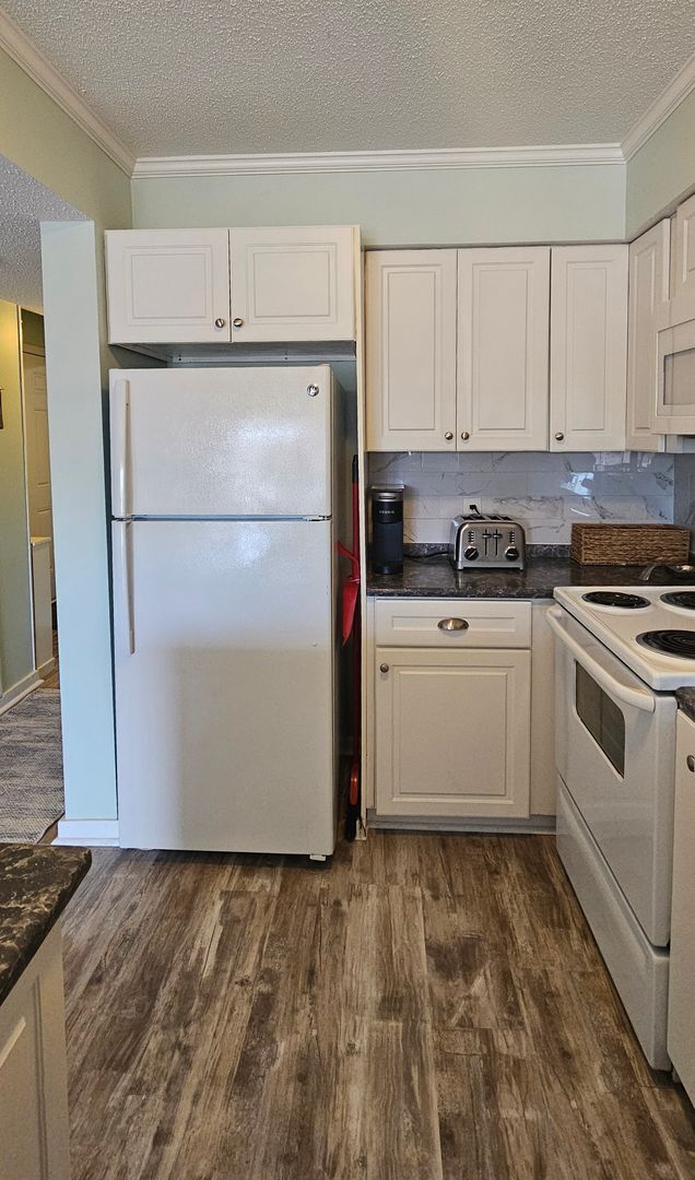 Building Photo - Dreamy Little River Condo — Furnished, Elevator Access, Pool & Marina Nearby!