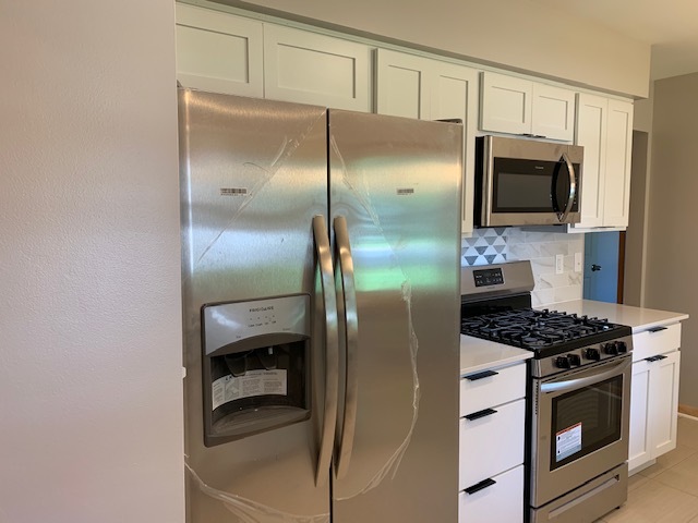 New White cabinets, quartz counters and appliances - 5206 Grandview Ln