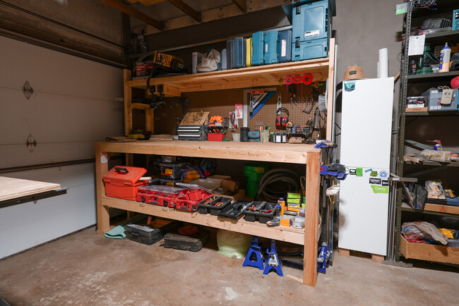 Garage. Perfect space for fabrication shop, storage, or to park your car. Has woodstove - 2507 3rd St NE