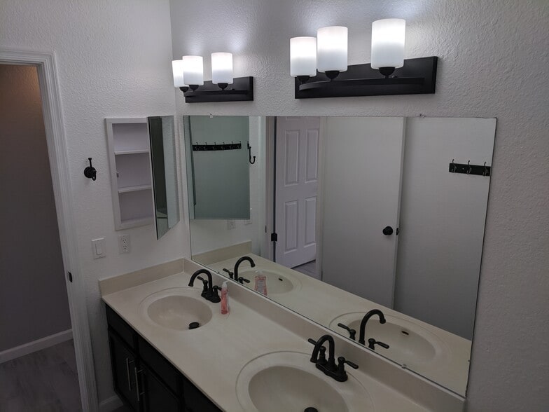 Hall bath - Vanity and medicine cabinet - 14101 N 78th Dr