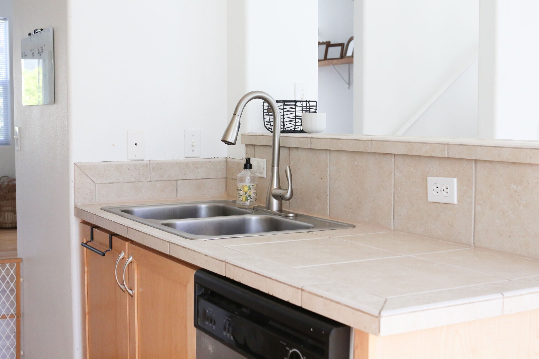 Double sink, kitchen counter and dishwasheer - 15458 SW Mallard Dr