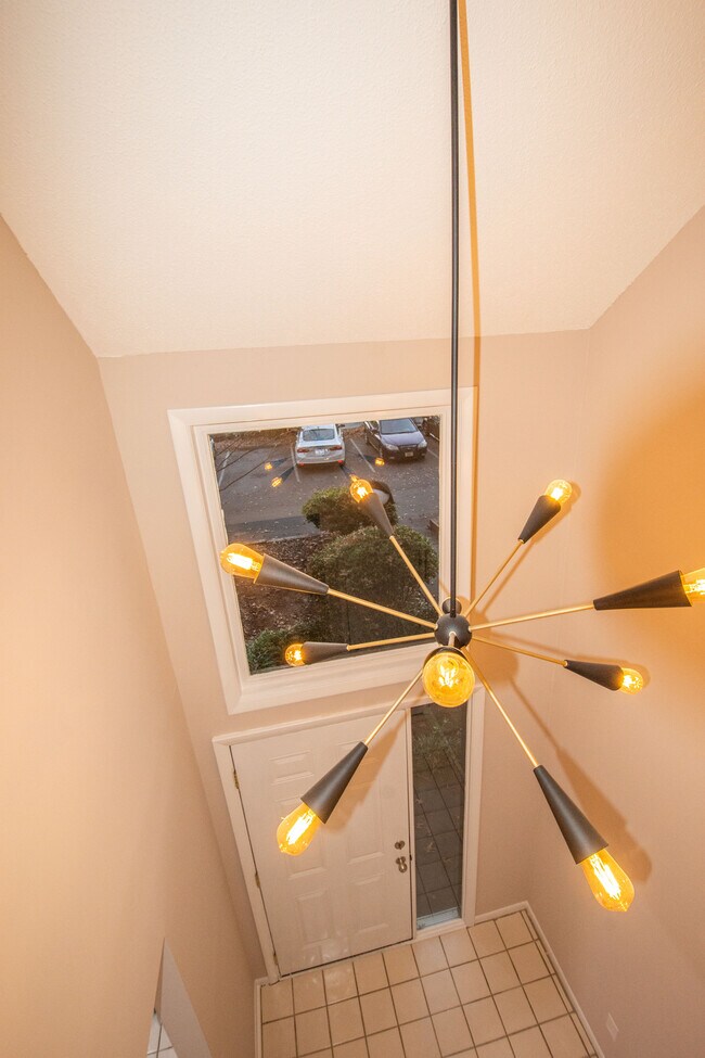 View of the Foyer with high slanted ceiling & tile floor from the upstairs Landing - 115 Beechnut St