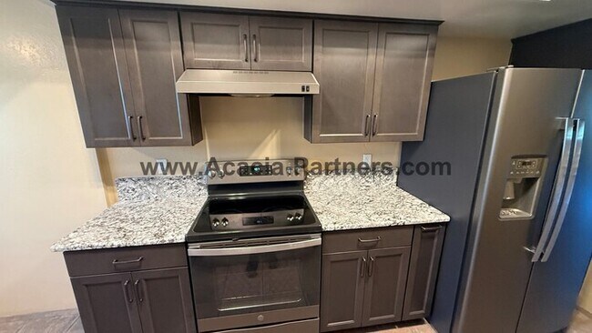 Building Photo - Three bedroom townhome with community pool