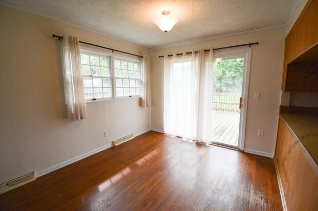 Building Photo - Beautiful multi-level with Gorgeous Yard and LOTS of Storage!
