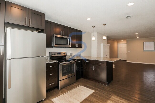 Building Photo - Move in before December 15th and choose your reward: a $250 Amazon Gift Card or a 55" Smart TV!