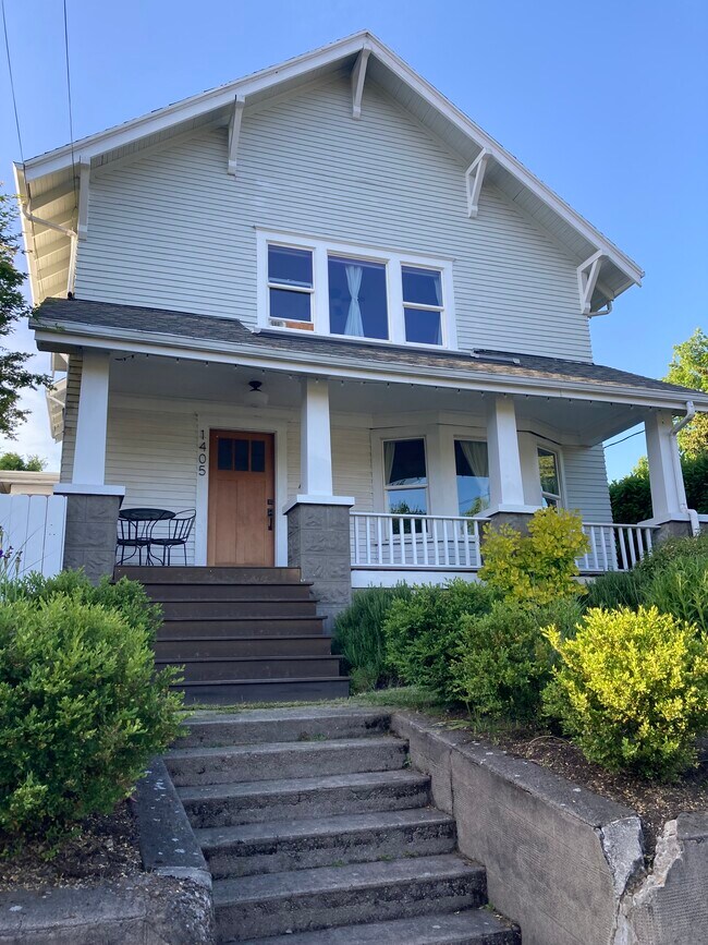 Constructed in 1912, but with recent energy efficient upgrades, this home is spacious, light + cozy. - 1405 NE Buffalo St