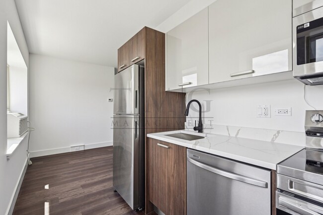 Building Photo - Sleek, Bright & Brand New — Stylish Studio in Andersonville