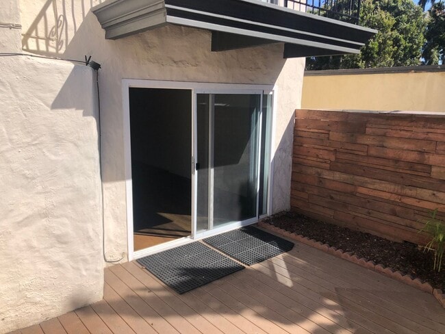 Building Photo - Beautiful Townhome with large fenced back patio, second story balcony, and two covered parking spots