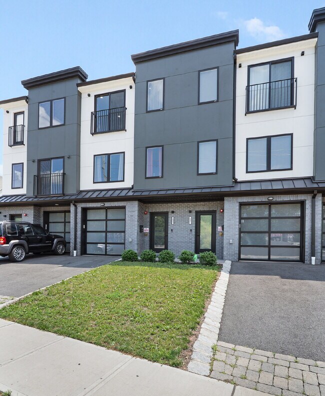 Building Photo - Movie in special, first 1/2 month rent is FREE! Charming 2-Bedroom Condo with 2 Full & 2 Half Bat...