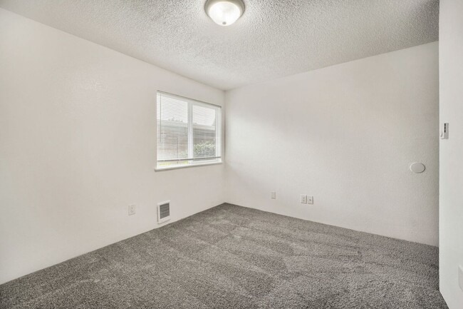 Building Photo - AVAILABLE NOW! 2BR/2BA Condo – Awesome Location! Glossy Hardwoods, Granite Countertops, W/S/G Inc...