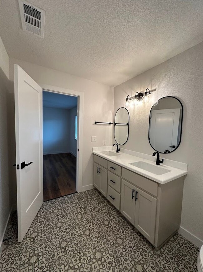 Building Photo - Updated Home with Island Kitchen, LVP Flooring, and Yard Care Included!