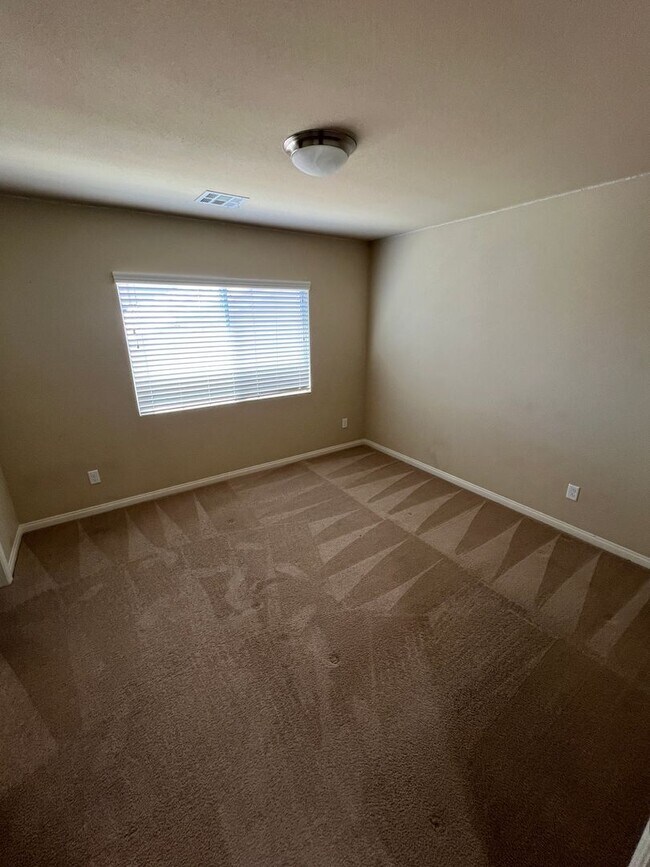 Building Photo - A Fantastic 4 Bedroom Home with the primary Downstairs, in Silverado Ranch