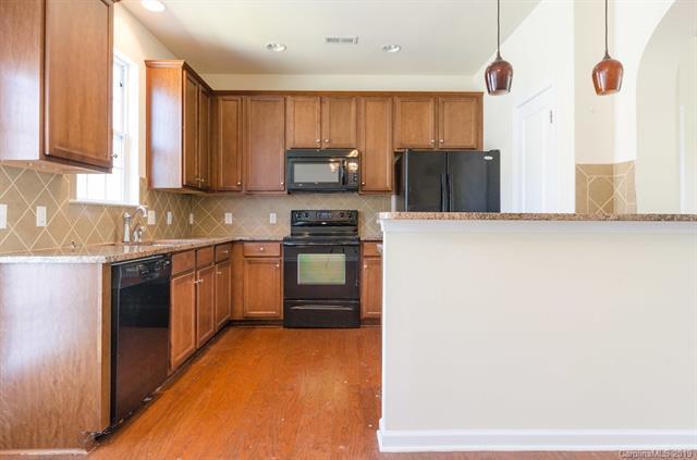 Building Photo - "Charming 3-Bed Oasis with Granite Accents & Pool Retreat in Belmont!"