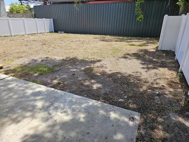 Building Photo - fully renovated 2-bedroom, 1-bathroom home with bonus guest room or office and oversized fenced yard