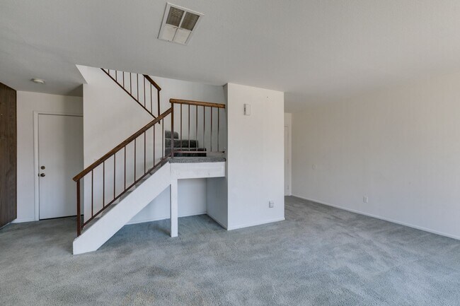 Building Photo - Double Primary Townhome with Spacious Backyard in 89115!